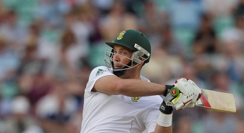 Jacques Kallis having recently hit a cricket ball using a cricket bat